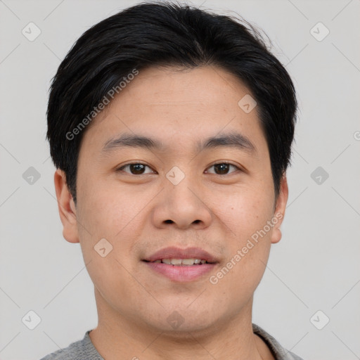 Joyful asian young-adult male with short  black hair and brown eyes