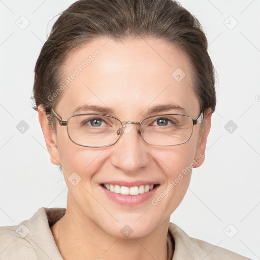 Joyful white adult female with short  brown hair and grey eyes