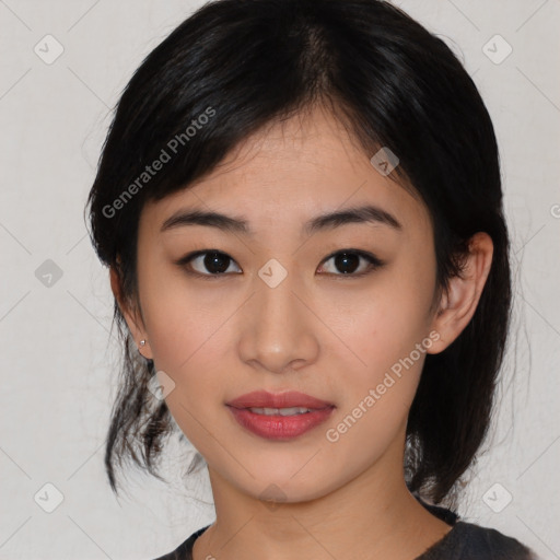 Joyful asian young-adult female with medium  black hair and brown eyes