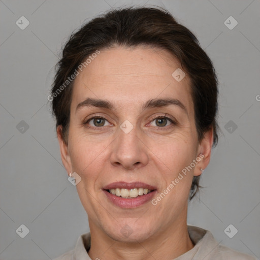 Joyful white adult female with short  brown hair and brown eyes