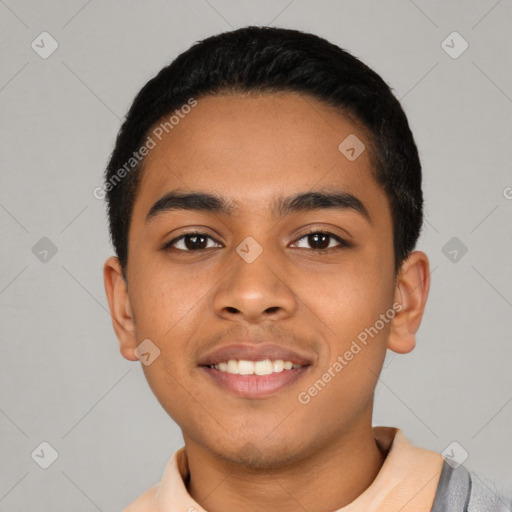 Joyful latino young-adult male with short  black hair and brown eyes