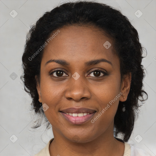 Joyful black adult female with medium  brown hair and brown eyes