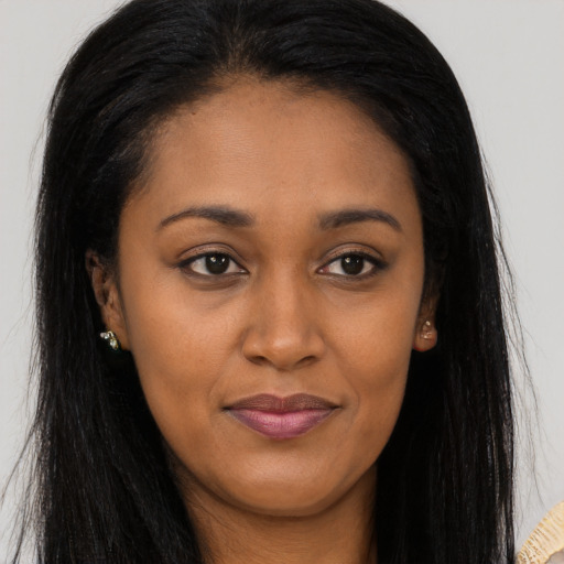 Joyful asian young-adult female with long  brown hair and brown eyes