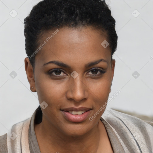 Joyful black young-adult female with short  brown hair and brown eyes