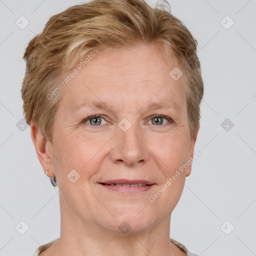 Joyful white adult female with short  brown hair and grey eyes