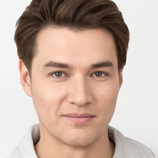 Joyful white young-adult male with short  brown hair and brown eyes