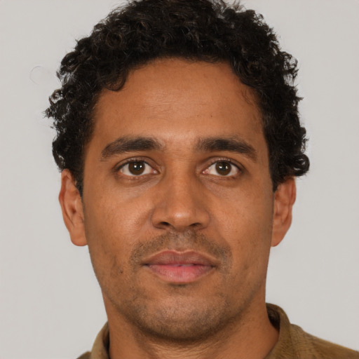 Neutral latino young-adult male with short  brown hair and brown eyes