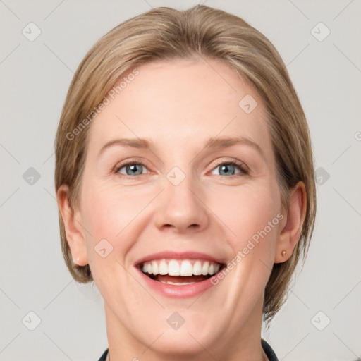 Joyful white young-adult female with medium  brown hair and blue eyes