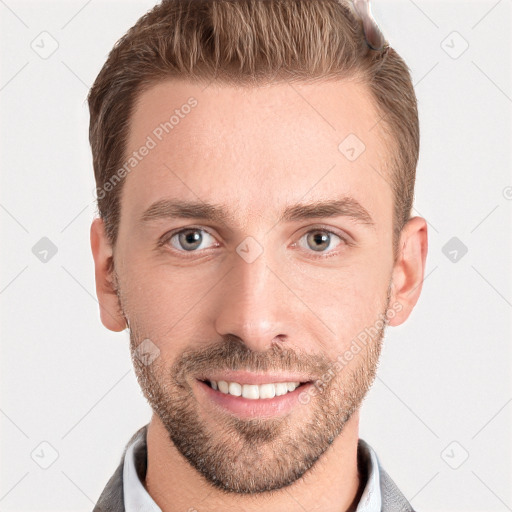 Joyful white young-adult male with short  brown hair and grey eyes