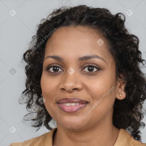 Joyful black young-adult female with long  brown hair and brown eyes