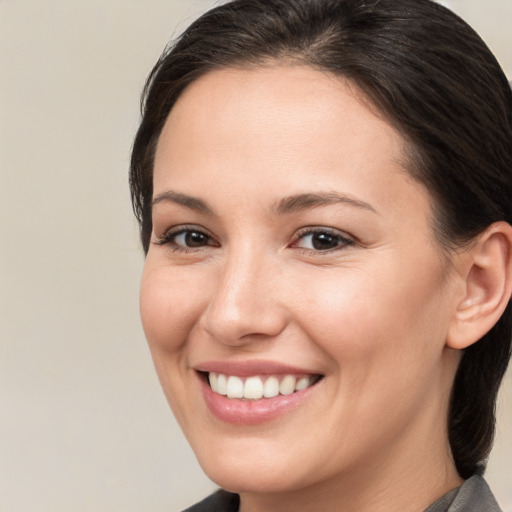 Joyful white young-adult female with medium  brown hair and brown eyes