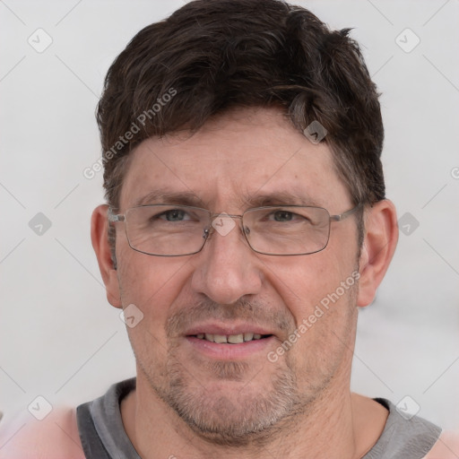 Joyful white adult male with short  brown hair and grey eyes