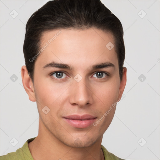 Joyful white young-adult male with short  brown hair and grey eyes