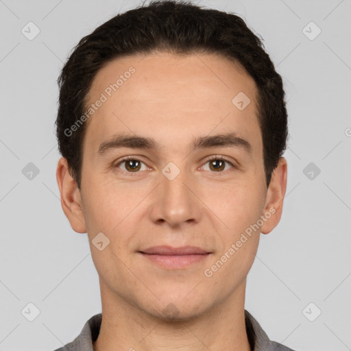 Joyful white young-adult male with short  brown hair and brown eyes