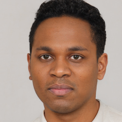 Neutral black young-adult male with short  black hair and brown eyes