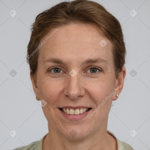 Joyful white adult female with short  brown hair and grey eyes