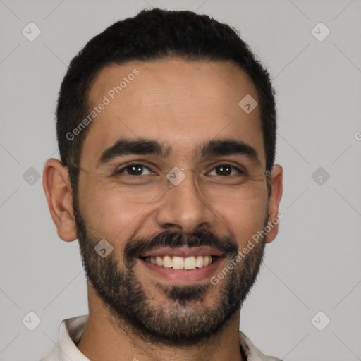 Joyful latino young-adult male with short  black hair and brown eyes