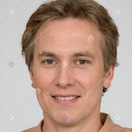 Joyful white adult male with short  brown hair and grey eyes