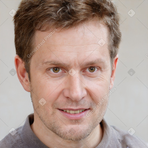 Joyful white adult male with short  brown hair and grey eyes