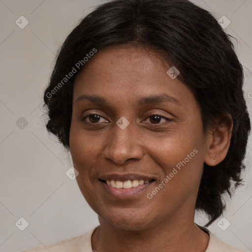 Joyful black young-adult female with medium  brown hair and brown eyes