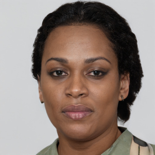Neutral latino adult female with short  black hair and brown eyes