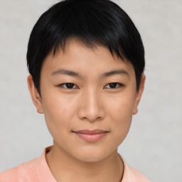 Joyful asian young-adult female with short  brown hair and brown eyes