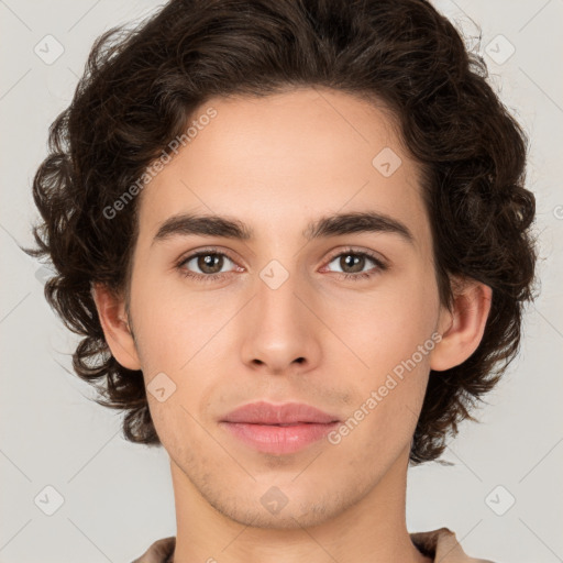 Joyful white young-adult male with medium  brown hair and brown eyes