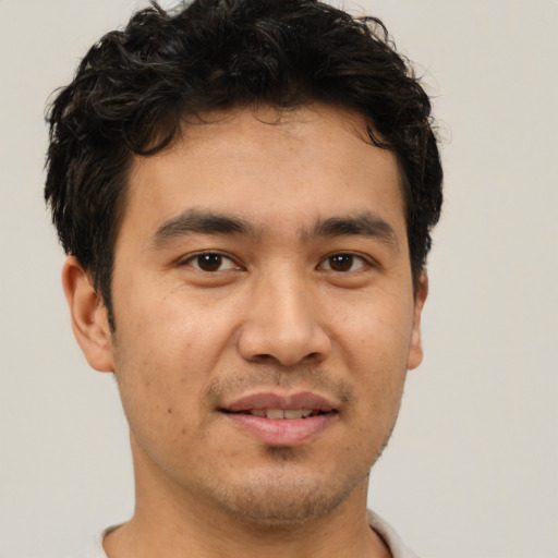 Joyful asian young-adult male with short  brown hair and brown eyes
