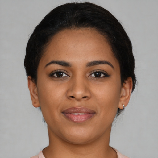 Joyful latino young-adult female with short  brown hair and brown eyes