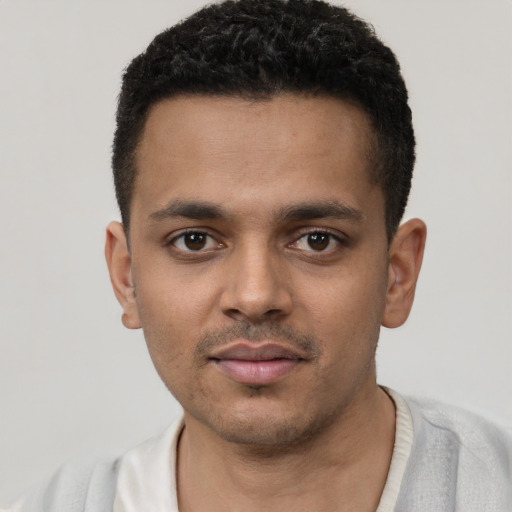 Neutral white young-adult male with short  black hair and brown eyes
