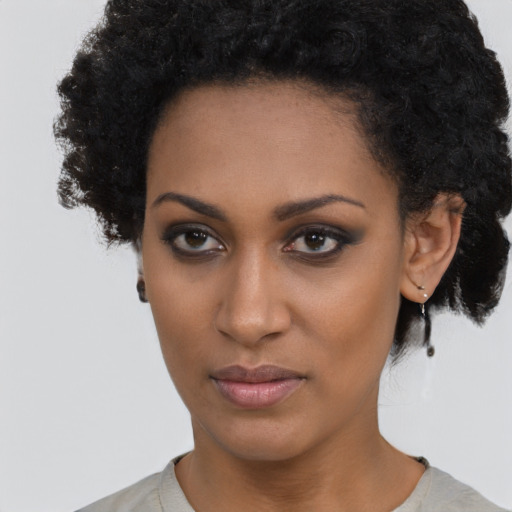 Neutral black young-adult female with short  black hair and brown eyes