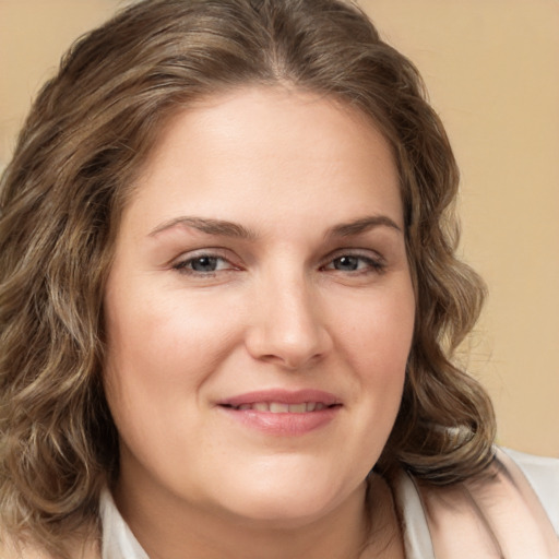 Joyful white young-adult female with medium  brown hair and brown eyes