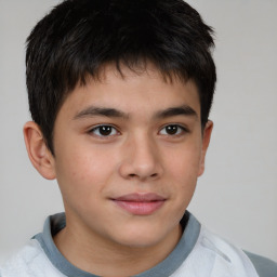 Joyful white child male with short  brown hair and brown eyes