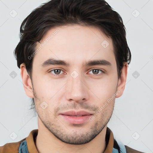 Neutral white young-adult male with short  brown hair and brown eyes