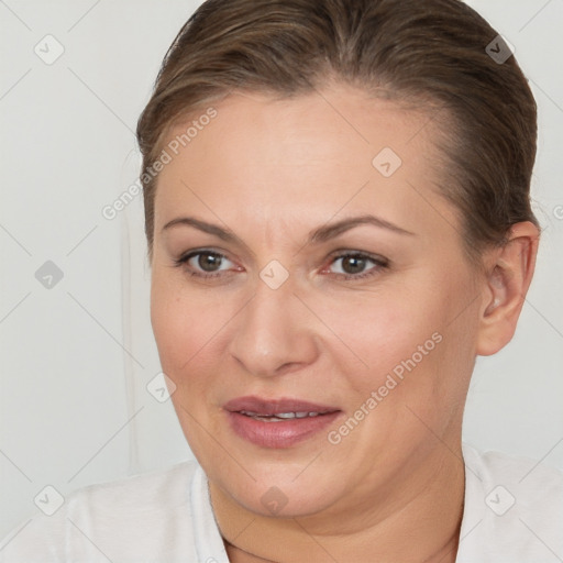 Joyful white adult female with short  brown hair and brown eyes