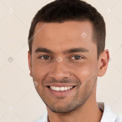 Joyful white young-adult male with short  brown hair and brown eyes