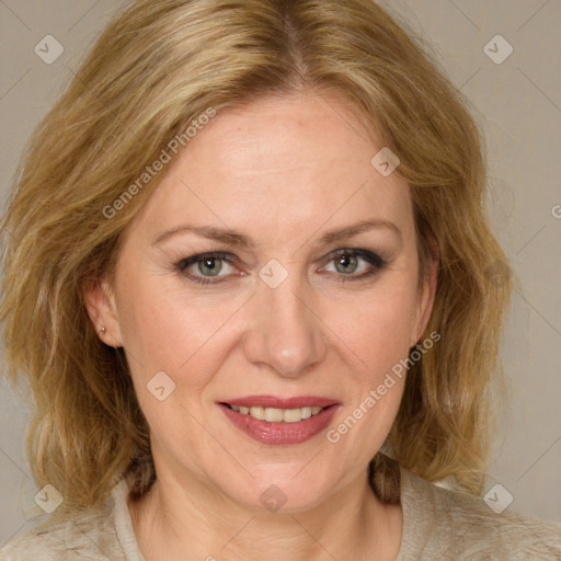 Joyful white adult female with medium  brown hair and blue eyes