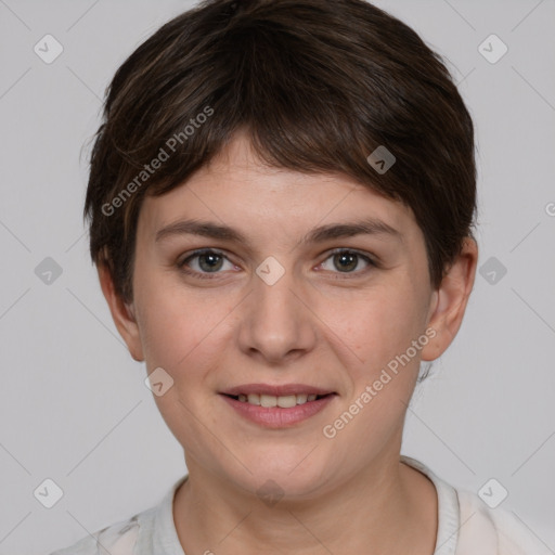 Joyful white young-adult female with short  brown hair and grey eyes