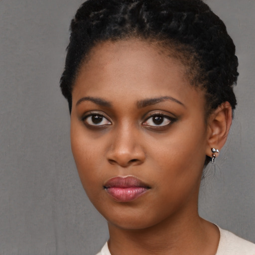 Neutral black young-adult female with short  black hair and brown eyes