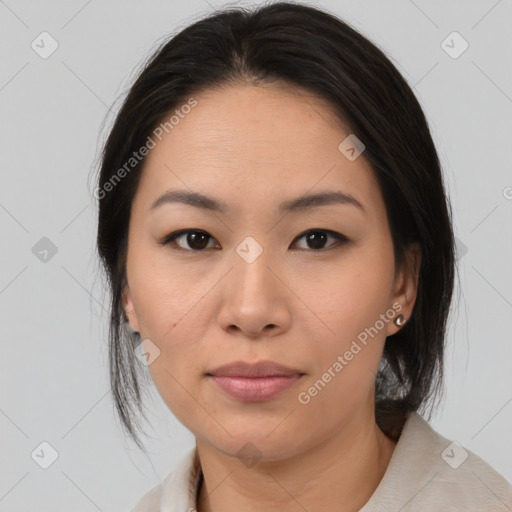 Joyful asian young-adult female with medium  black hair and brown eyes