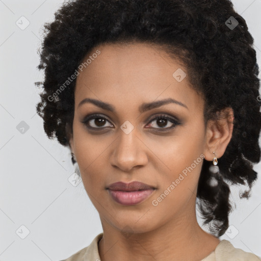 Joyful black young-adult female with long  brown hair and brown eyes