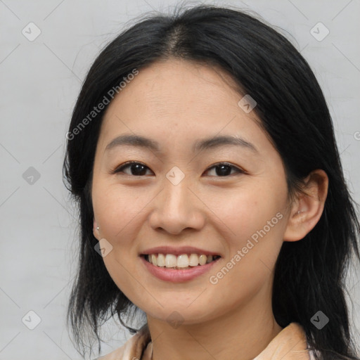 Joyful asian young-adult female with medium  black hair and brown eyes