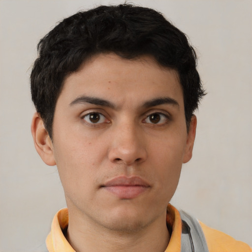 Neutral white young-adult male with short  brown hair and brown eyes