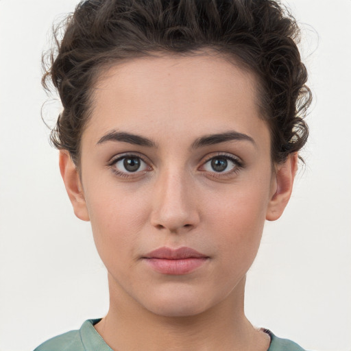 Neutral white young-adult female with short  brown hair and brown eyes