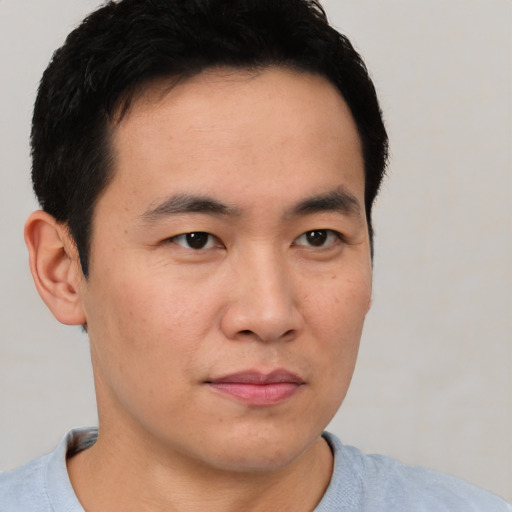 Neutral asian young-adult male with short  black hair and brown eyes
