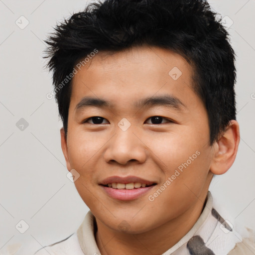 Joyful asian young-adult male with short  black hair and brown eyes