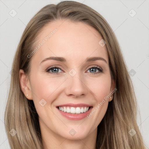 Joyful white young-adult female with long  brown hair and grey eyes