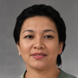 Joyful asian adult female with short  brown hair and brown eyes