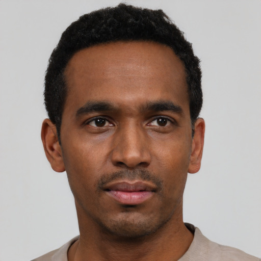 Neutral black young-adult male with short  black hair and brown eyes