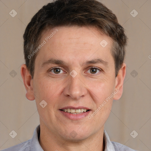 Joyful white adult male with short  brown hair and brown eyes